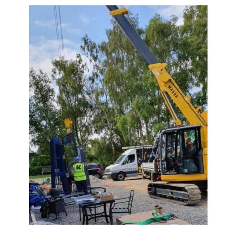 crane carrying the glazing for installation