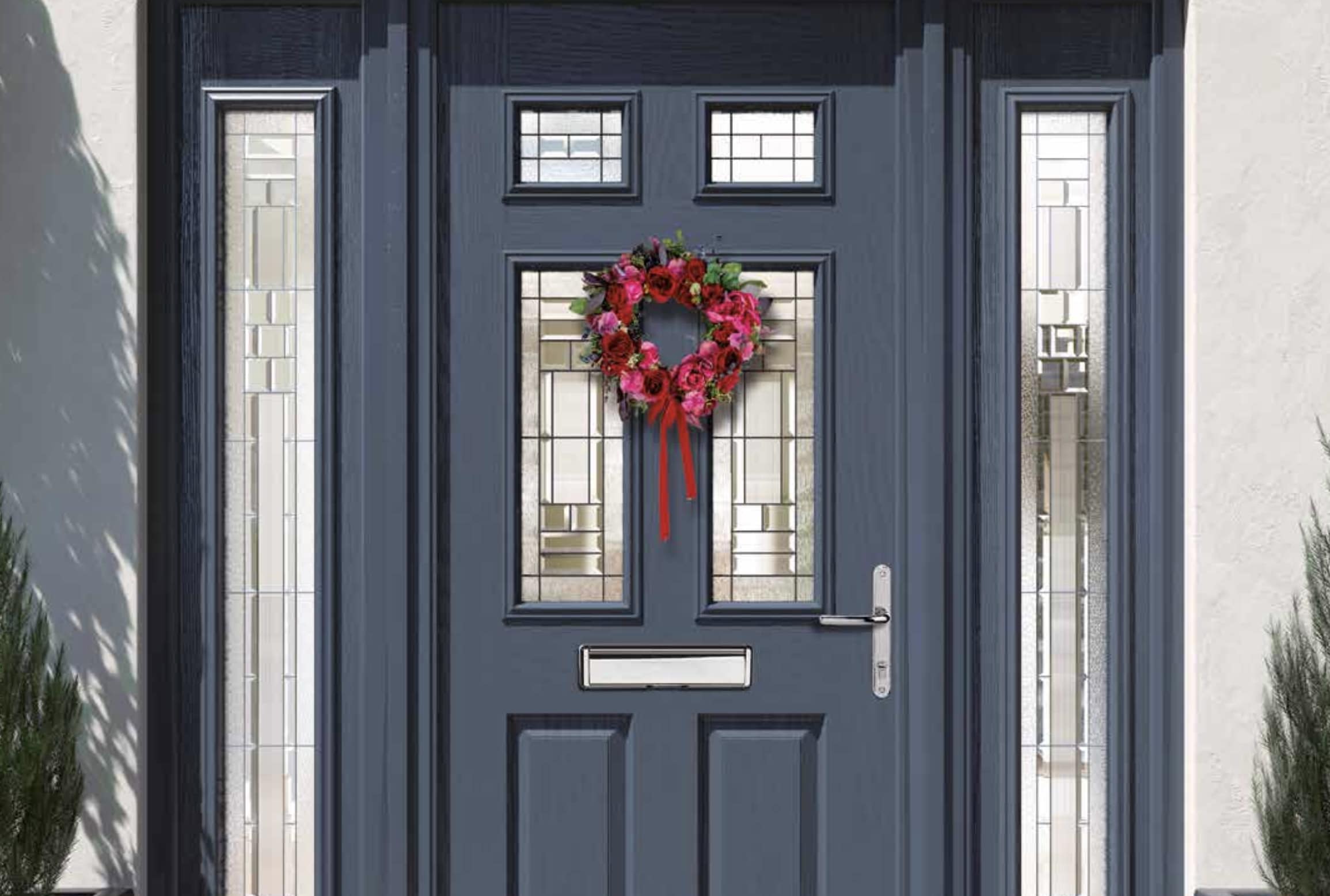 apeer front door with red wreath on the front