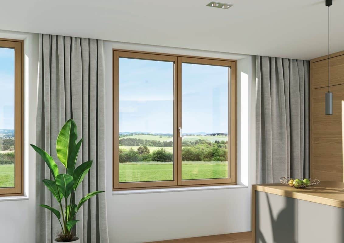 a room with large glass windows and a clear view over the Wiltshire countryside.