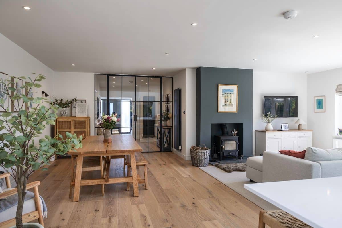 pciture of a contempoary room with RK steel internal doors dividing lounge and entrance hall